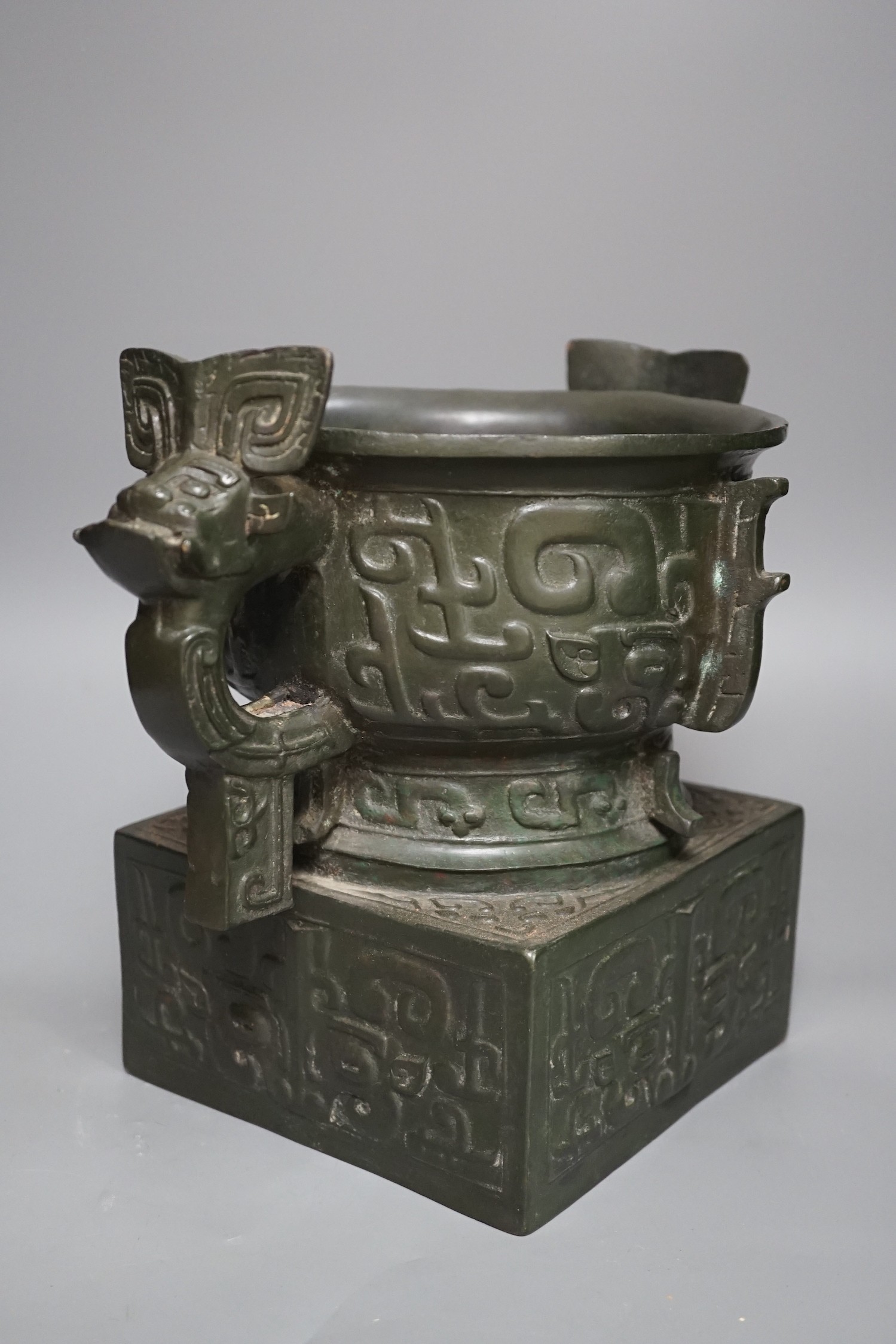 An archaistic Chinese bronze vase after the antique, modelled as an original bronze in the collection of the Palace Museum, Beijing, boxed with certificate, cast number 35. 25.5cm tall